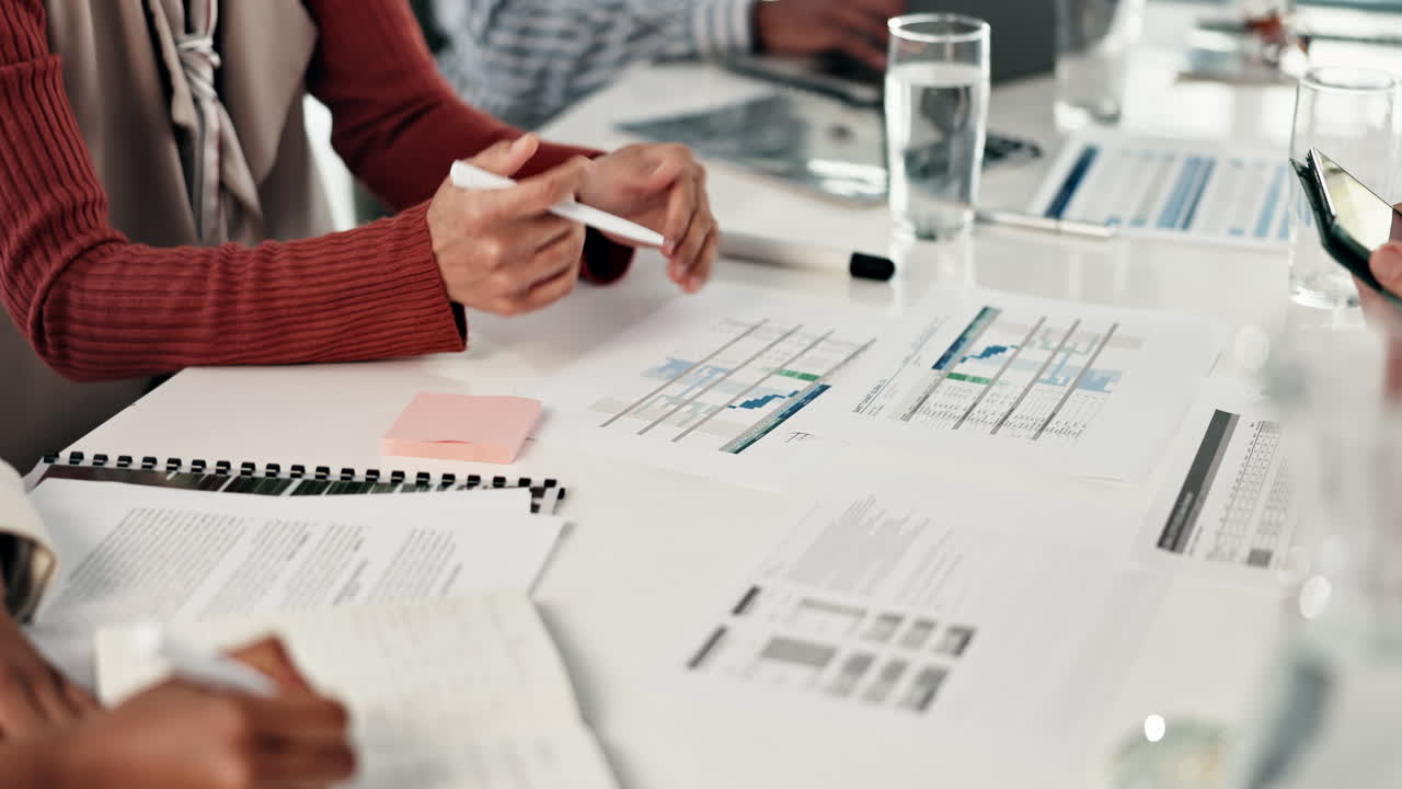 Business meeting with data analysis and planning