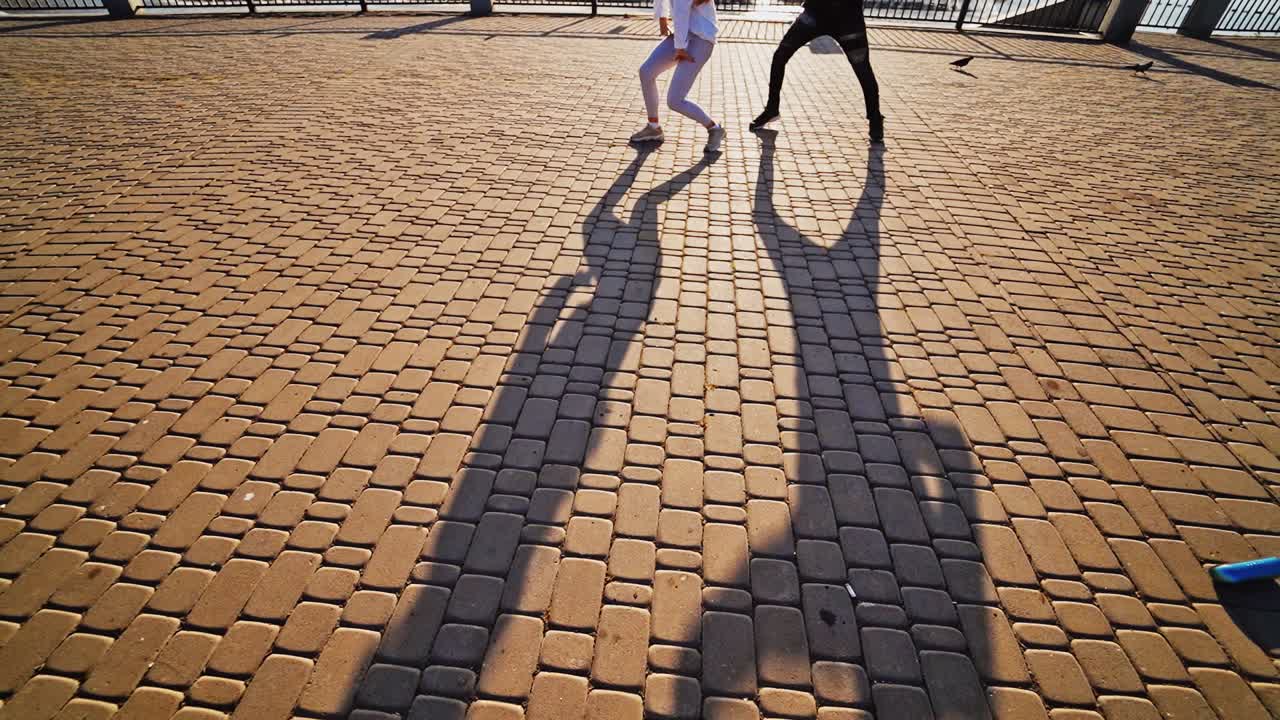 Passionate couple dancing outdoors. Cute romantic couple spending time together in the city
