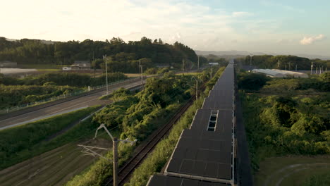 close aerial of solar panels installed on an abandoned monorail track in japan