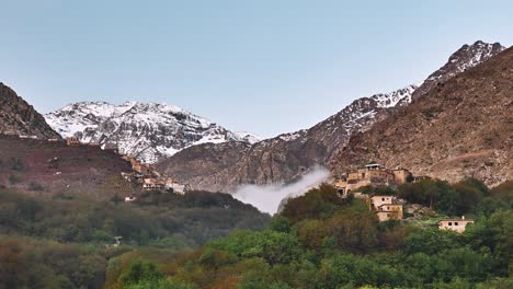 morning fog under jebel toubkal in imlil valley, morocco, time lapse