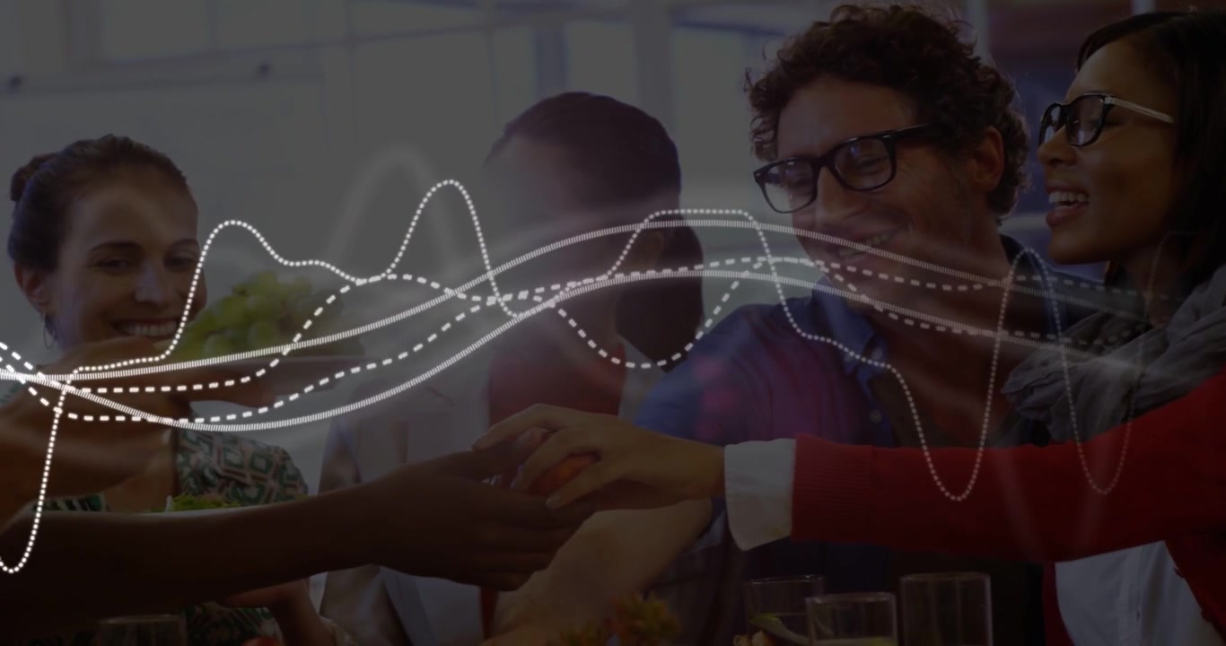 Vertical video: Team pointing, hands passing tiny item on desk for biz plan, waveform overlaying