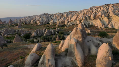 epic cinematic drone shot slowly going through the fair chimneys and tuffs in cappadocia, turkey