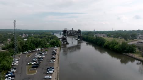 Bridge-in-Joliet,-Illinois-along-the-Des-Plaines-River-with-drone-video-moving-forward