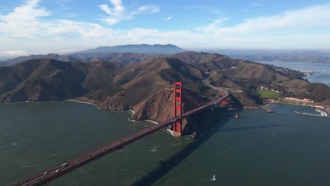 aerial view of the marin headlands and the famous, red golden gate bridge - orbit, drone shot