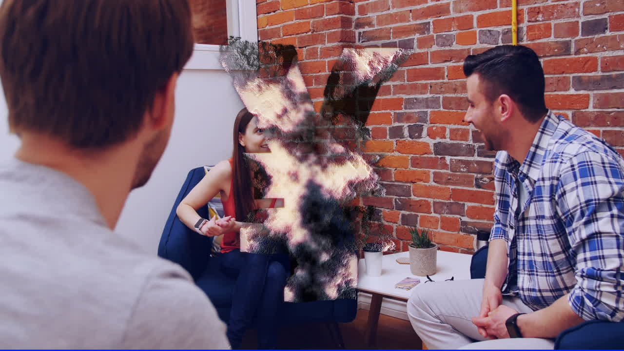 Digital distortion animation over people having casual conversation in office setting