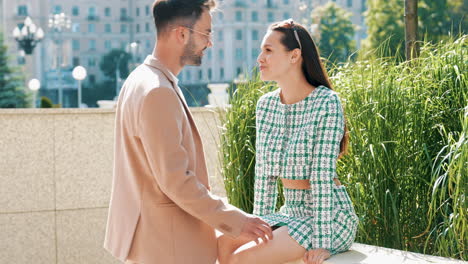 couple enjoying a conversation in a city park