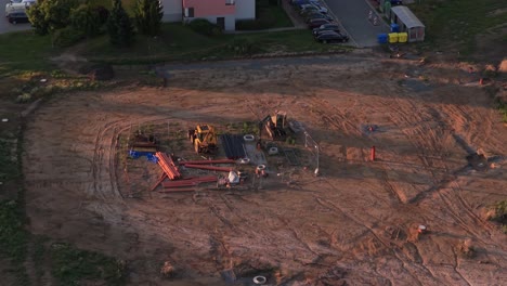 abandoned excavators on a construction site. workplace with building materials from a drone perspective