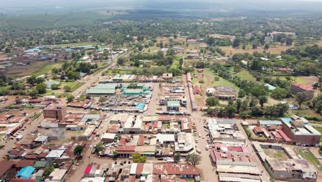 aerial drone view open air market in the loitokitok town, kenya and mount kilimanjaro- rural village of kenya