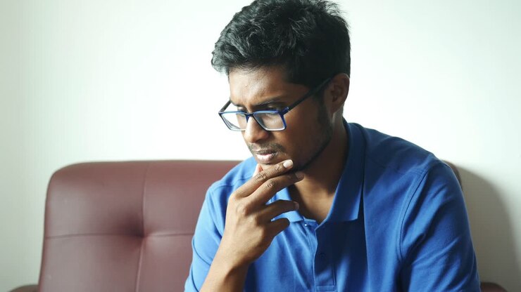 Depressed man feeling sick and worried about financial problem