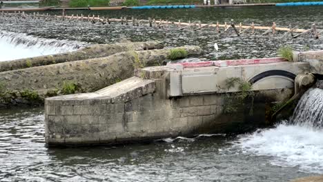 small dam on the oi river in arashiyama, kyoto, japan