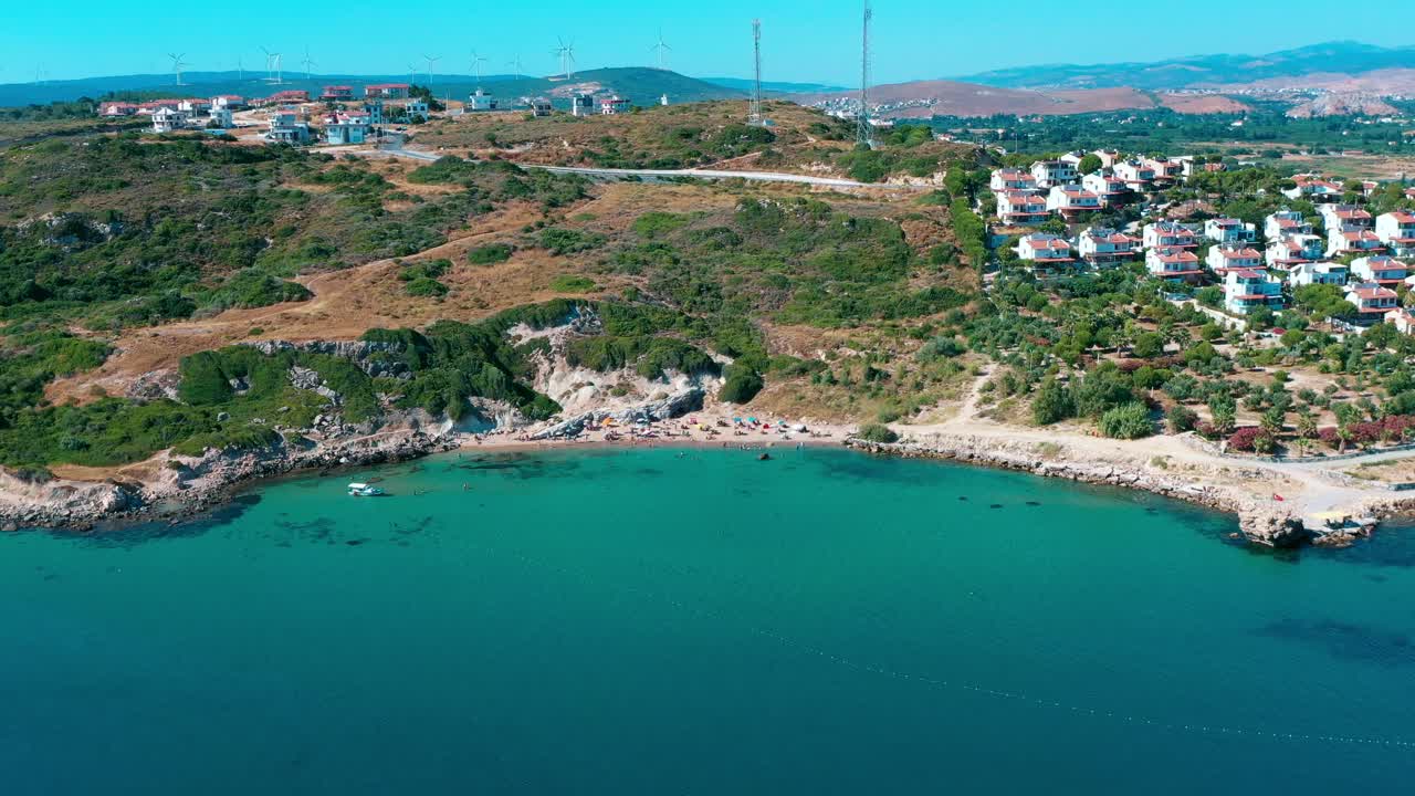 4k aerial footage taken by drone of people sunbathing on the beach and swimming in the sea in Izmir-Turkey