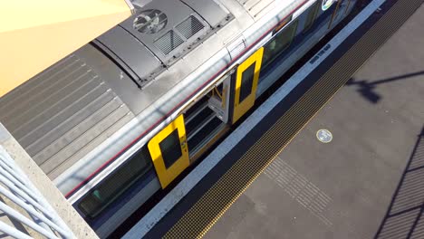 train door closes on electric multiple unit shot from above