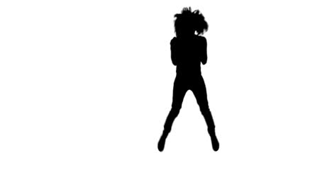 Silhouette-of-woman-with-a-microphone-dancing