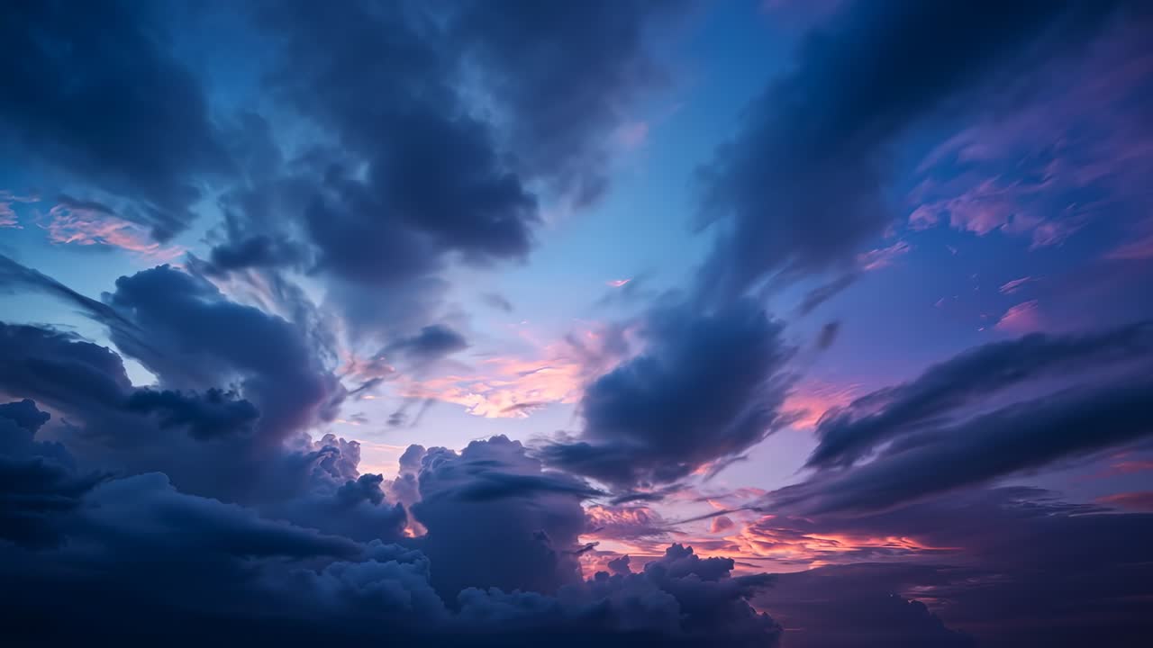 Sunset light widening gaps, shifting large cumulus mass glowing over open sky with purple hues
