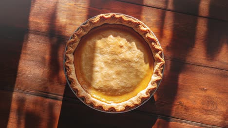 Homemade-Pie-on-Rustic-Wooden-Table-with-Dappled-Sunlight