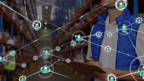 Animation-of-network-of-profile-icons-over-caucasian-male-supervisor-checking-stock-at-warehouse