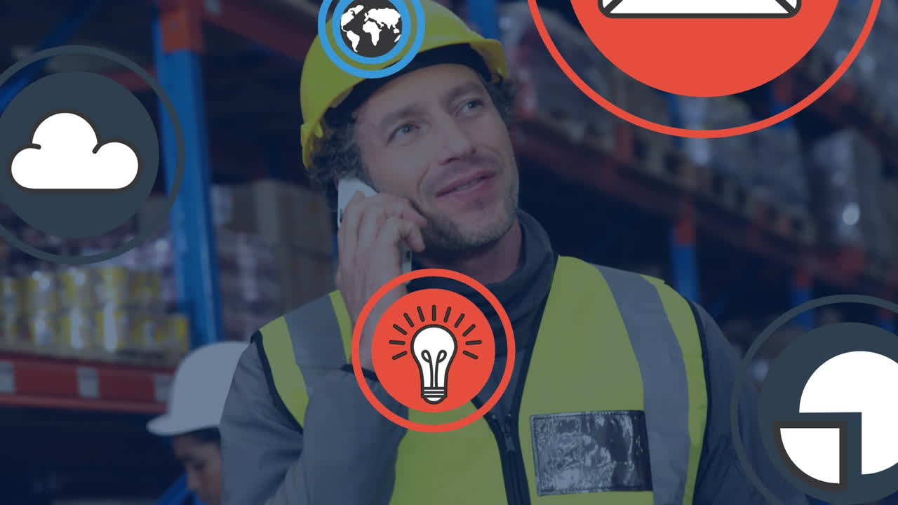 animación de iconos contra trabajador de fábrica caucásico en ropa de protección hablando por teléfono en el almacén