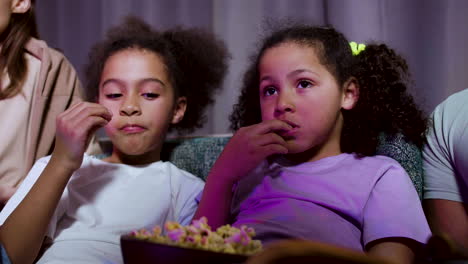 kids watching film at home