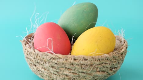 colorful easter eggs in a nest