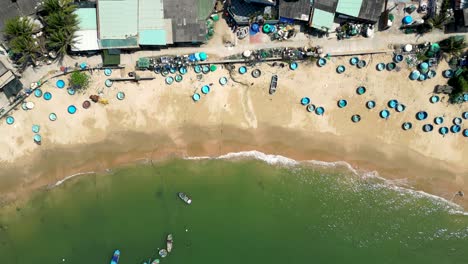 stunning top down drone view over beautiful sandy beach at vietnamese fishing village