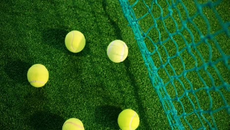 overhead view of tennis balls on grass 4k
