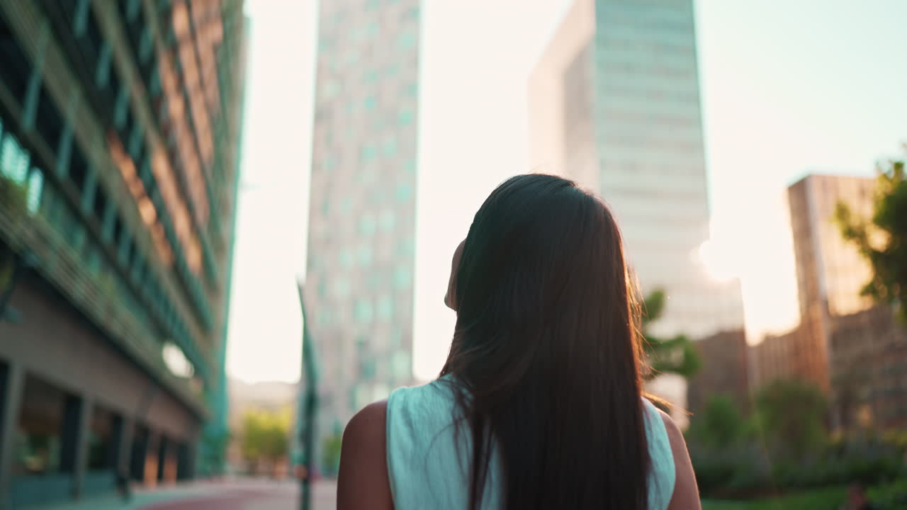 Woman looking up in the city