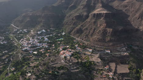 Aerial-view-in-orbit-over-the-houses-of-the-city-of-Temisas-and-the-Audiencia-caves-in-the-municipality-of-Aguimes,-Gran-Canaria