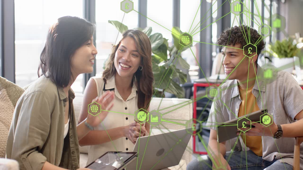 Three-person team gesturing at laptop starting data review for tech project with green data overlay