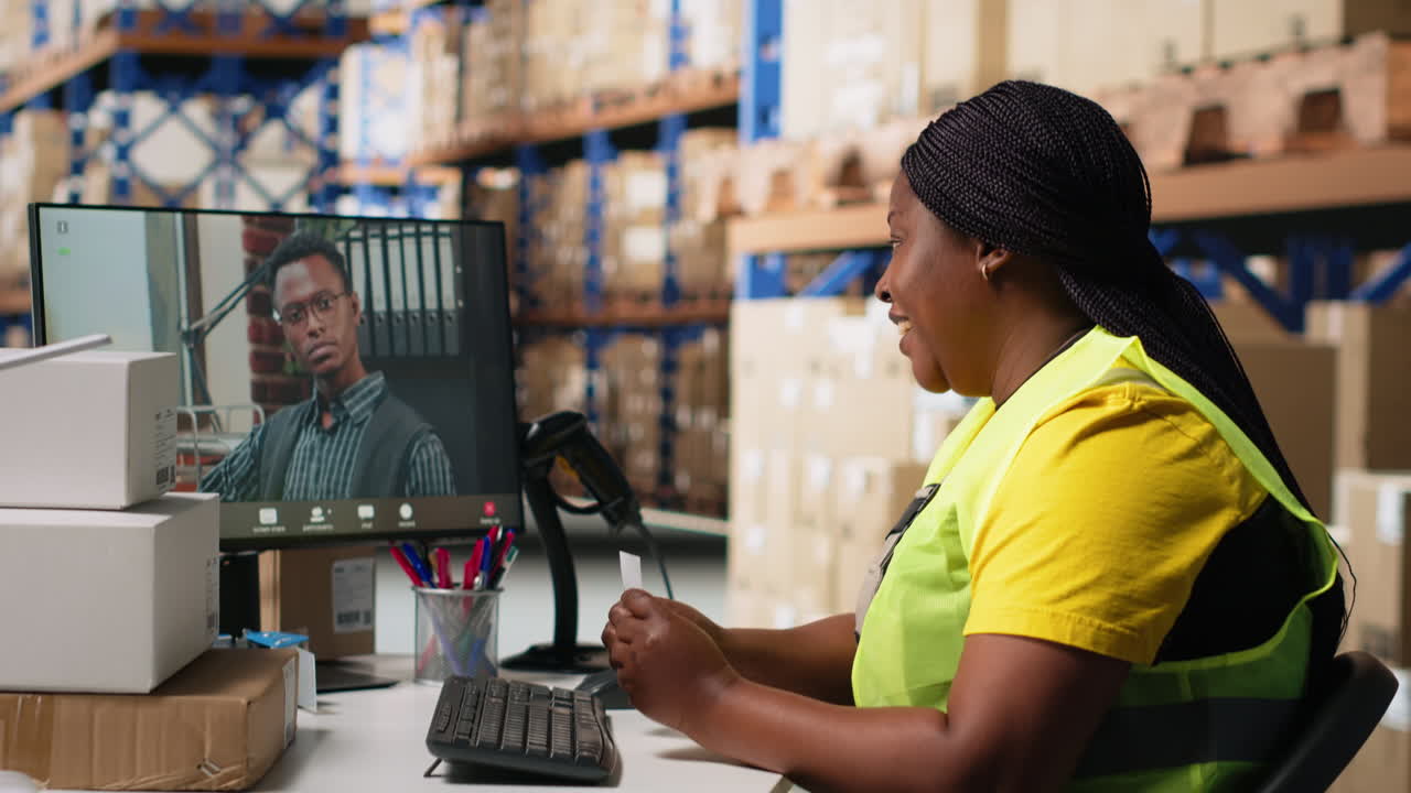African american woman discussing with a manager on web video call