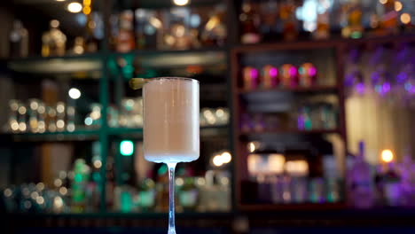 piña-colada-slider-shot-bar-blurry-background