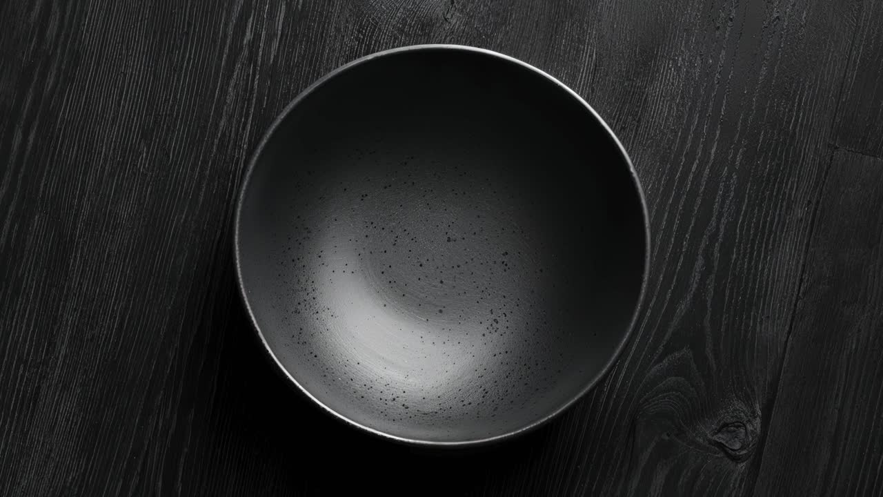Empty Black Bowl on a Wooden Table