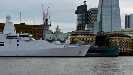 hnlms holland p840 docked next to hms belfast, london, united kingdom