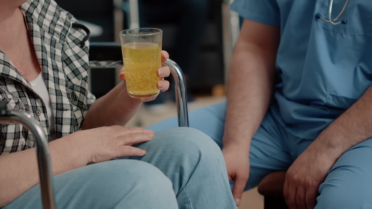 Close up of retired woman drinking effervescent medicine