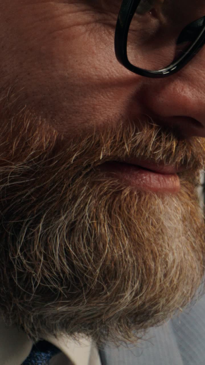 Close-up of a Man with Glasses and Beard