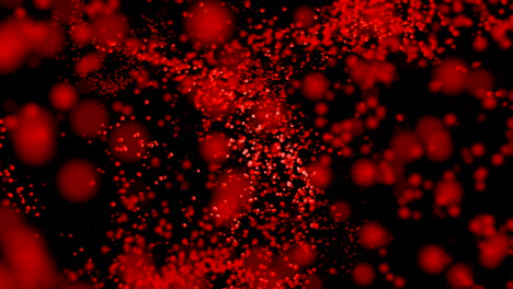 red particles on black background