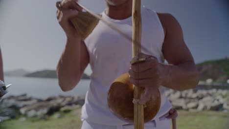 playing the berimbau for capoeira