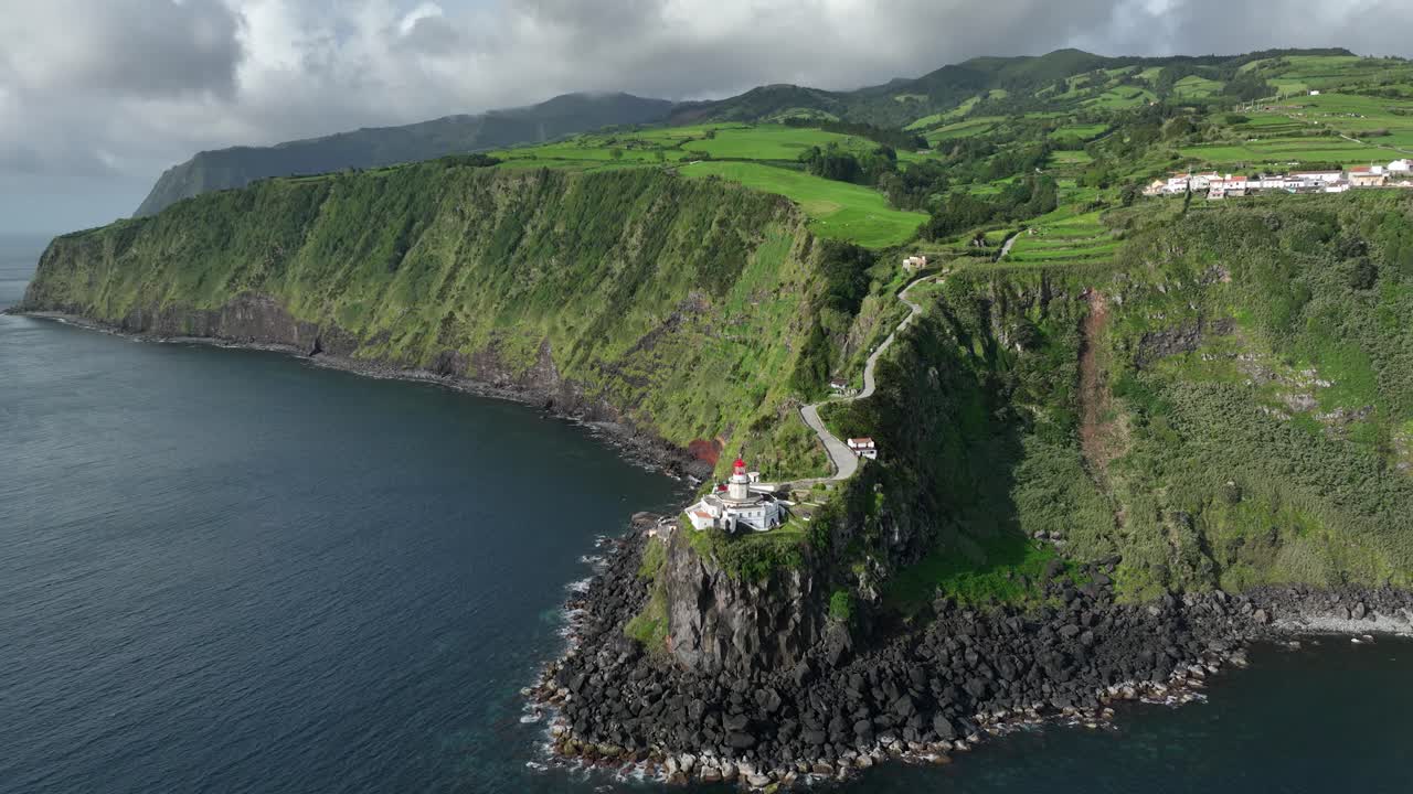 Ponta do Arnel lighthouse dramatic setting on headland, S&atilde;o Miguel, drone
