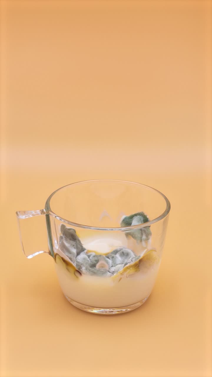 Milk in a glass getting spoiled. 3 weeks in 20 seconds. Timelapse
