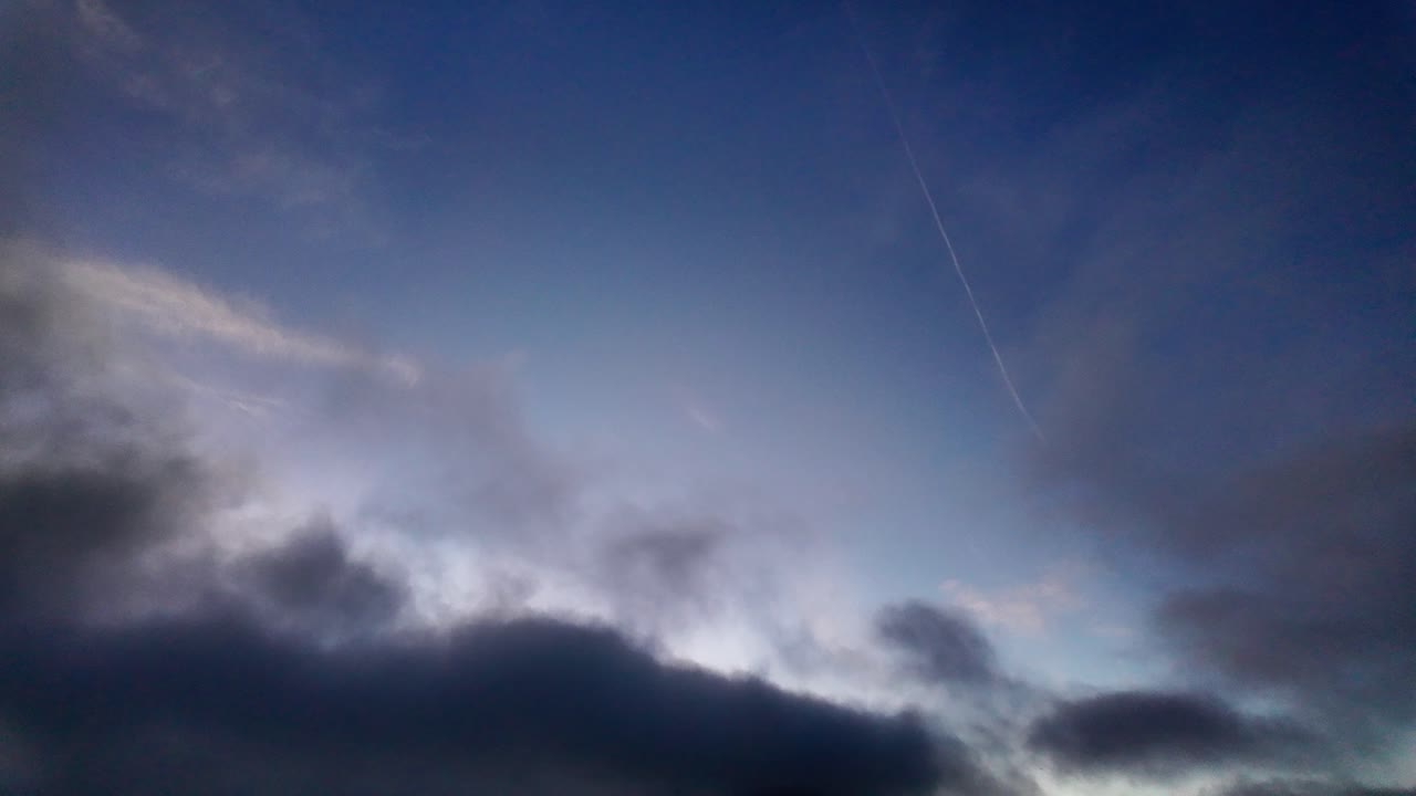 Gimbal wide booming down shot of Morro Rock during a dramatic sunset in Morro Bay, California. 4K