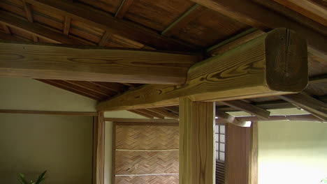 Wooden-beams-and-rafters-under-roof-of-Japanese-building