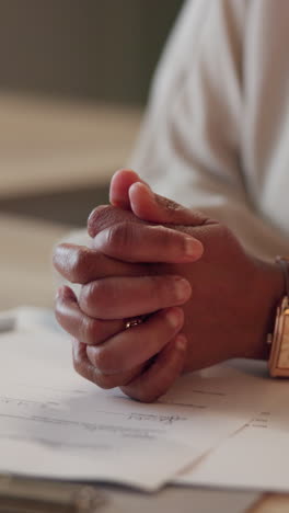 close-up of a woman's hands on a desk