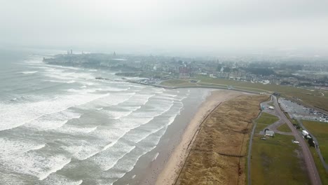 St-Andrews-city-shrouded-in-fog-and-rough-sea,-Scotland