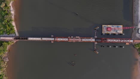 birds eye view of train traveling over the calcasieu river in lake charles, louisiana