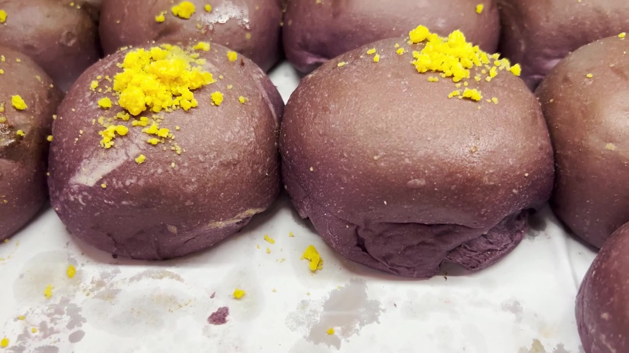 Freshly Baked Purple Ube Buns Topped With Yellow Crumbs