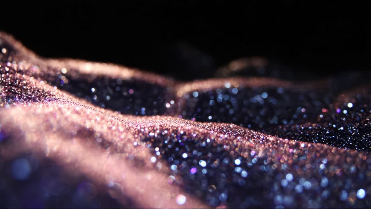 A Captivating Glimpse of Sparkling Particles: Mesmerizing Waves of Glittering Dust Captured in Close-Up, Showcasing the Beauty and Intricacy of Light Reflections on Shimmering Surfaces