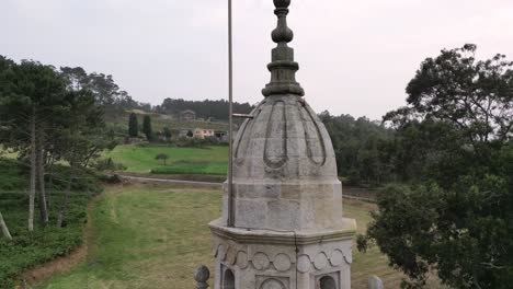 closeup of bell tower on coastal hill overlooking seascape