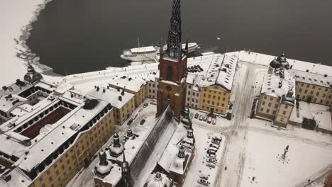 drone flying backwards in aerial view of famous tourist destination in the capital of sweden, stockholm