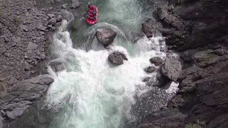 people enjoying an outdoor adventure, white water river rafting in new zealand - top view