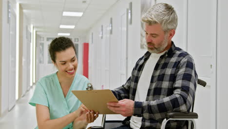 nurse assisting a patient in a hospital hallway