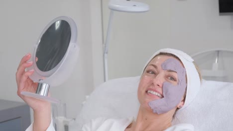 a calm and serene woman is enjoying a rejuvenating professional facial treatment at a modern spa setting